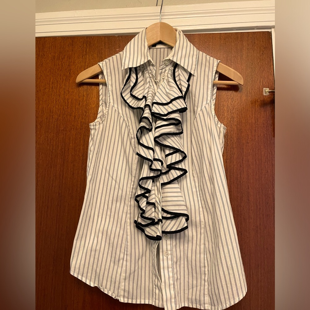 Ruffle front sleeveless blouse